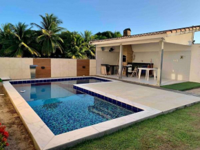 Casa completa com dois quartos, condomínio com piscina e área de laser completa na praia BELA - PB